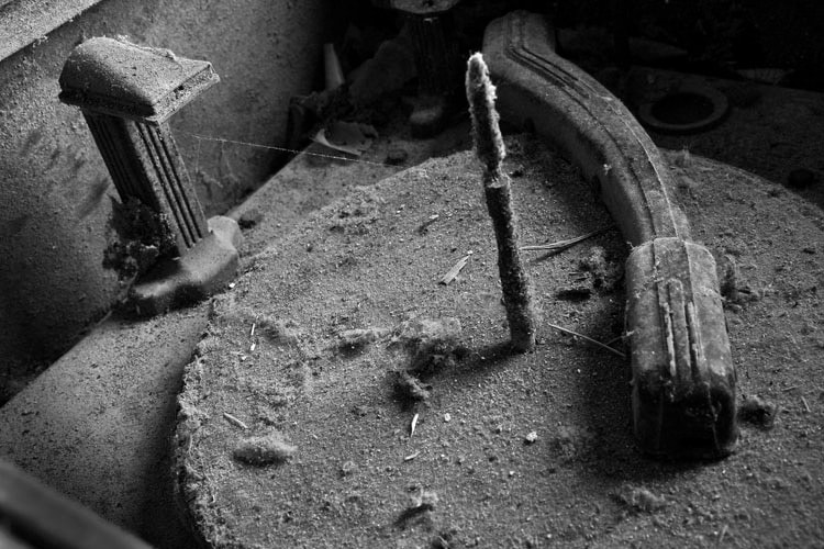 Dust-covered architectural remains in black and white