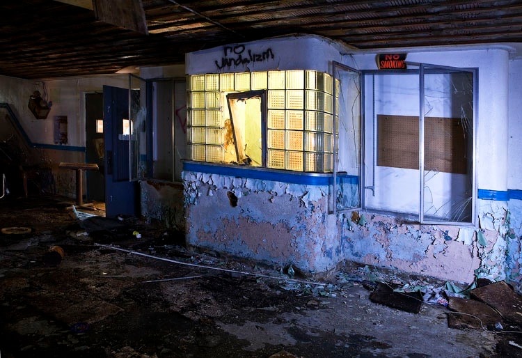 Deteriorated storefront ticket booth interior